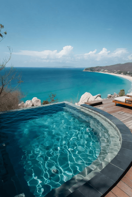 An infinity pool on a clifftop, looking out over a bay
